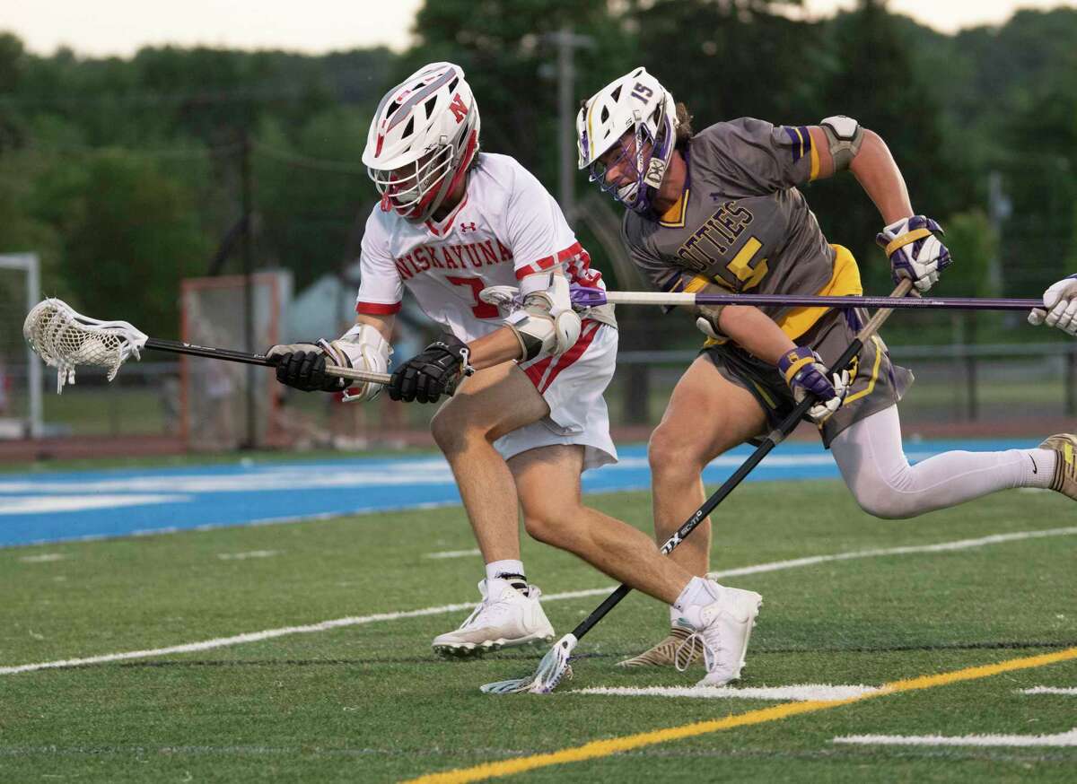 Niskayuna’s Davey Carroll, left, shown last season, had two goals in the Silver Warriors' 12-6 loss to Garden City in the Class B state semifinals on Friday, June 9, 2023, at UAlbany.