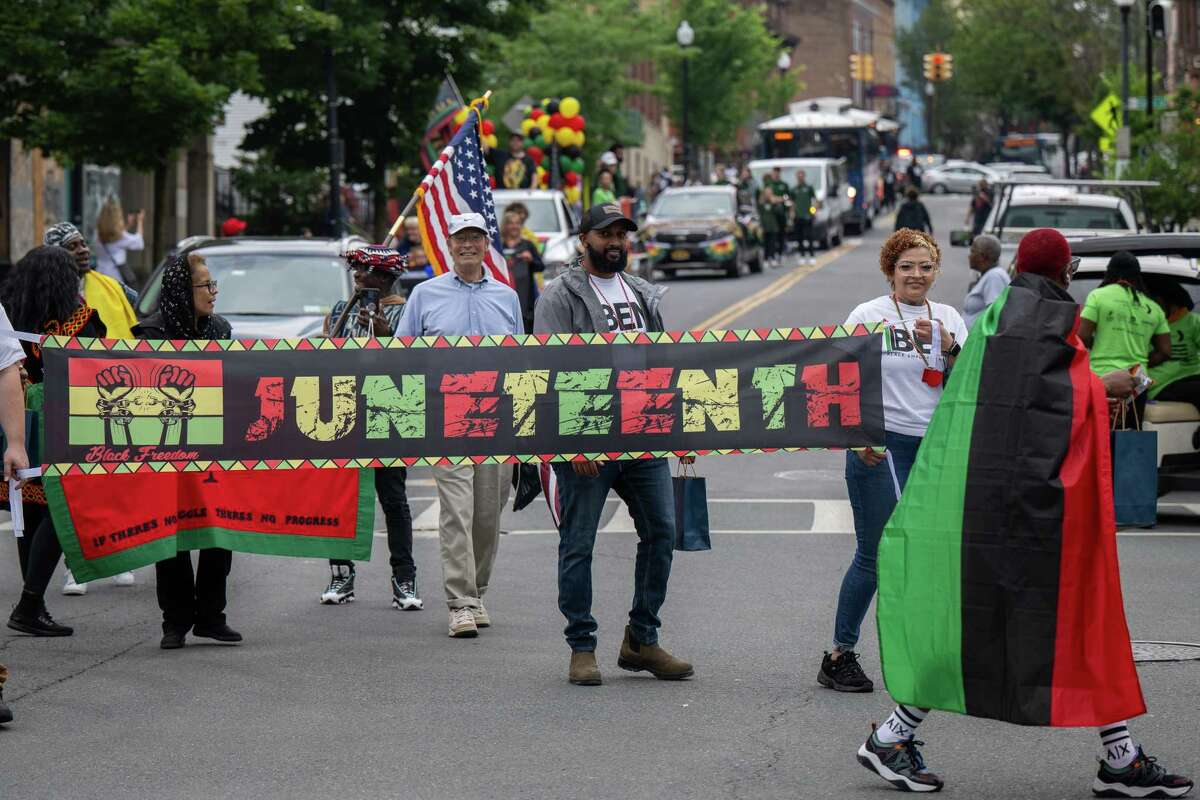 The Juneteenth parade at the intersection of Madison Avenue and Pearl Street. Marchers began in Washington Park and ended at the South End Grocery store on Saturday, June 17, 2023, in Albany, NY.