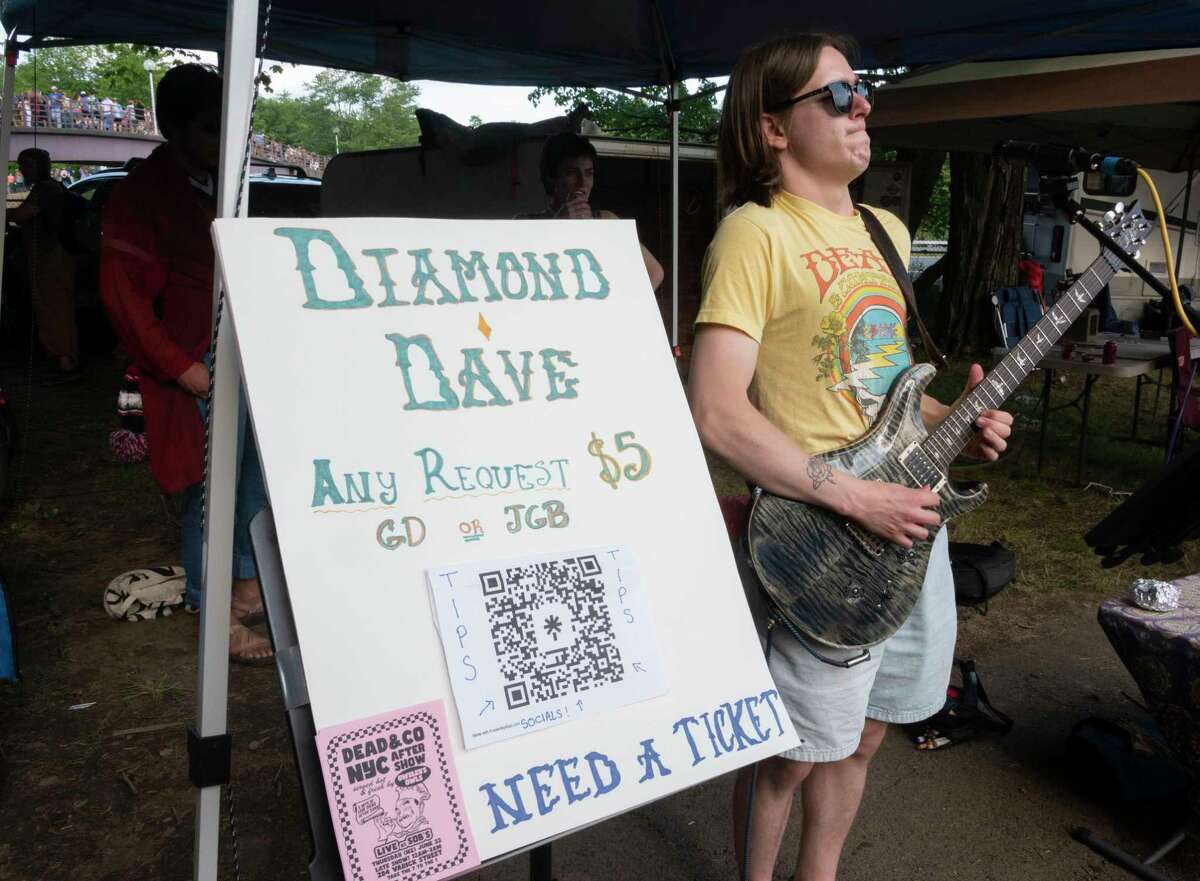 A musician is hopeful to score a ticket in the Shakedown Street parking lot before the last Dead and Company show at Saratoga Performing Arts Center on Sunday, June 18, 2023, in Saratoga Springs, N.Y. (Lori Van Buren/Times Union)