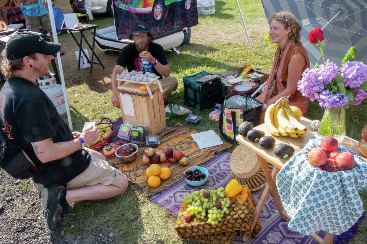 A vendor sells fruit in the Shakedown Street parking lot before the last Dead and Company show at Saratoga Performing Arts Center on Sunday, June 18, 2023, in Saratoga Springs, N.Y. (Lori Van Buren/Times Union)