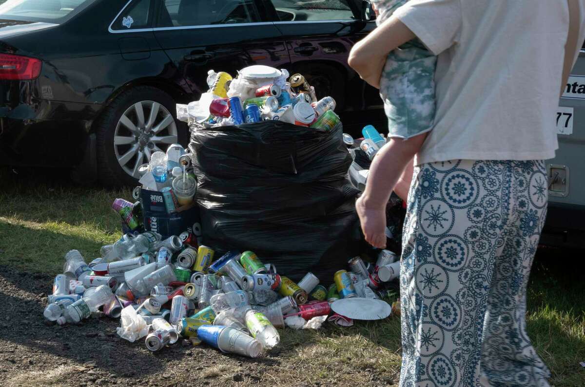 An over flowing trash bag is seen in the Shakedown Street parking lot before the last Dead and Company show at Saratoga Performing Arts Center on Sunday, June 18, 2023, in Saratoga Springs, N.Y. (Lori Van Buren/Times Union)