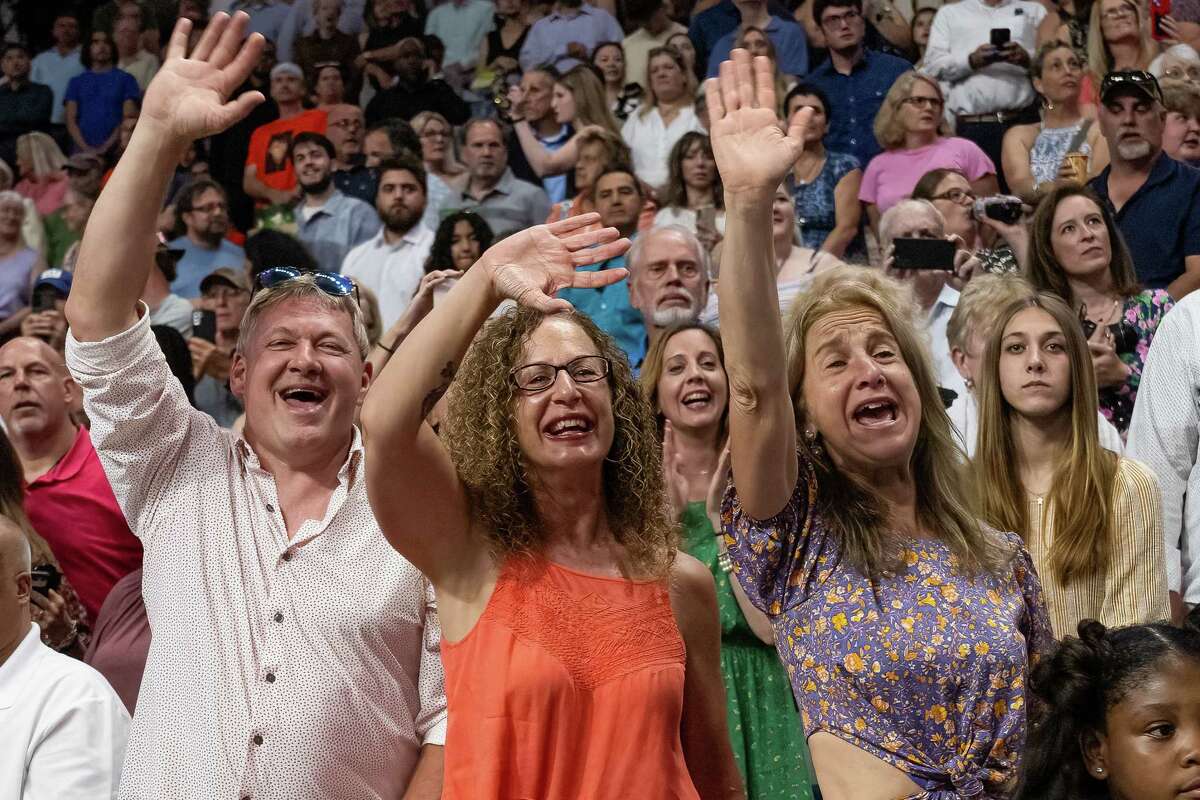 Michael Golonka, Rachael Angelini and Michelle Golonka cheer Bethlehem High graduate Matthew Golonka during his graduation ceremony on Friday, June 23, 2023, at the MVP Arena in Albany, NY.