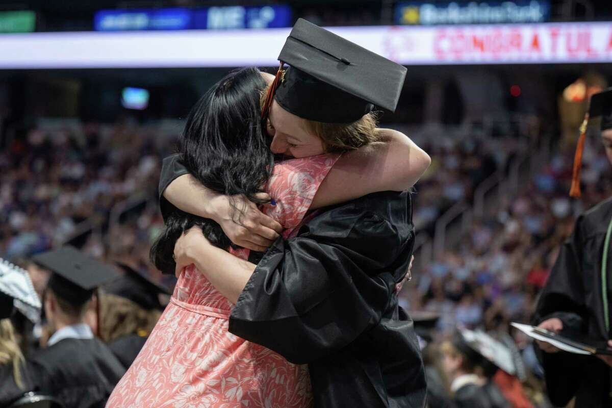 Bethlehem Central School District social worker Aerial White gives Bethlehem High graduate Chloe Heckman a hug during her graduation ceremony on Friday, June 23, 2023, at the MVP Arena in Albany, NY.