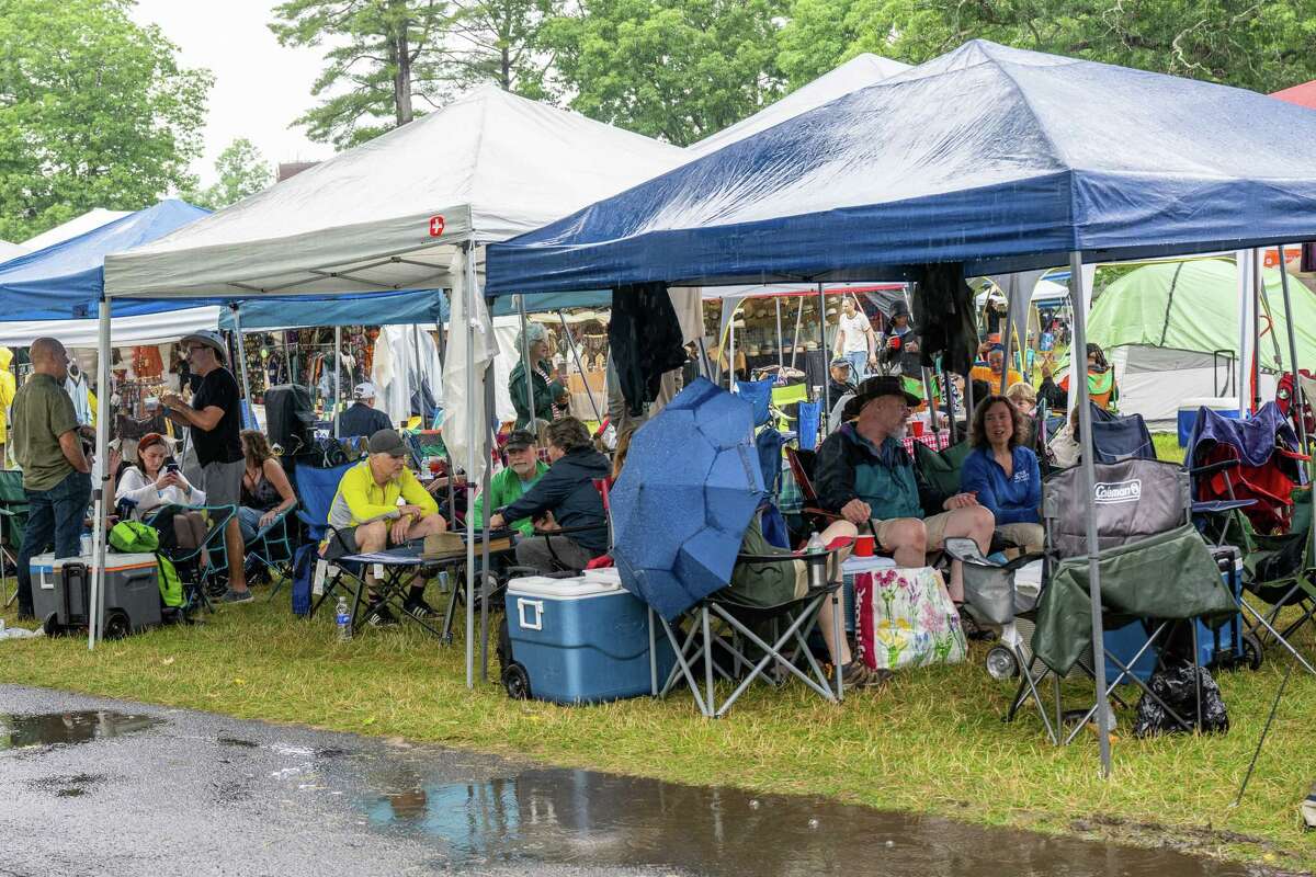 Music fans try to keep dry during a rainy Freihofer’s Jazz Fest on Saturday, June 24, 2023, at the Saratoga Performing Arts Center in Saratoga, NY.