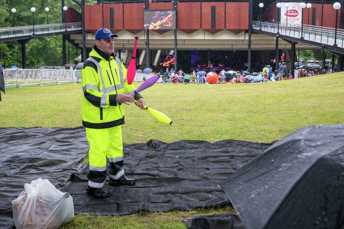 Brian Tappen juggles in the rain during the Freihofer’s Jazz Fest on Saturday, June 24, 2023, at the Saratoga Performing Arts Center in Saratoga, NY.