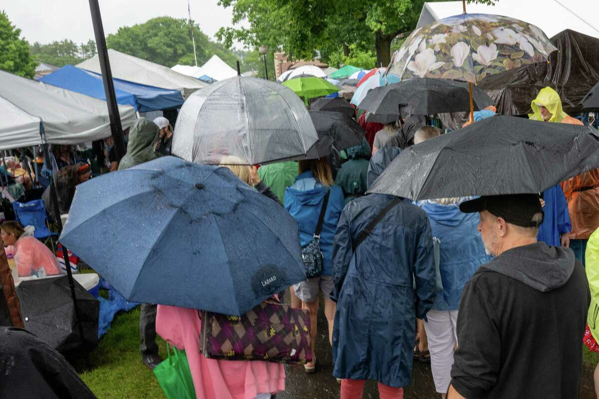 Music fans try to keep dry during a rainy Freihofer’s Jazz Fest on Saturday, June 24, 2023, at the Saratoga Performing Arts Center in Saratoga, NY.