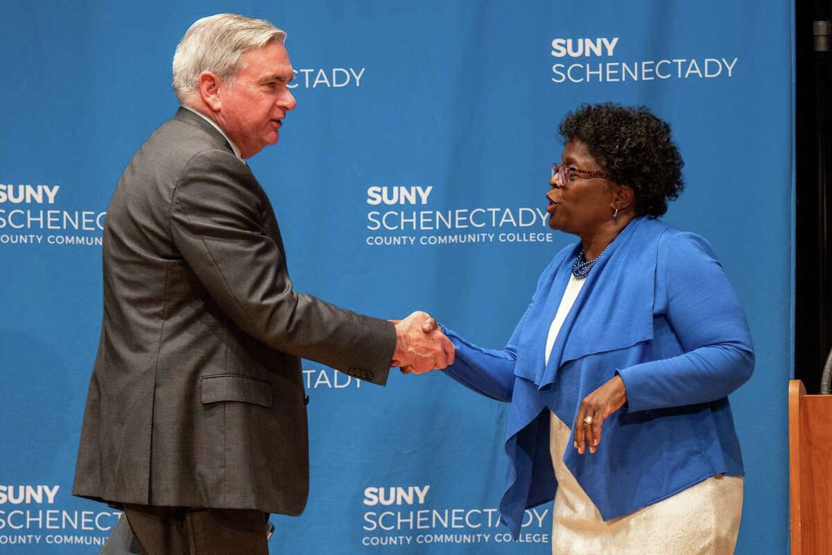 Schenectady Mayor Gary McCarthy and City Council President Marion Porterfield shake hands following a debate on Thursday, June 1, 2023, at Schenectady County Community College in Schenectady, NY. Primary day is Tuesday, June 27. (Jim Franco/Times Union).