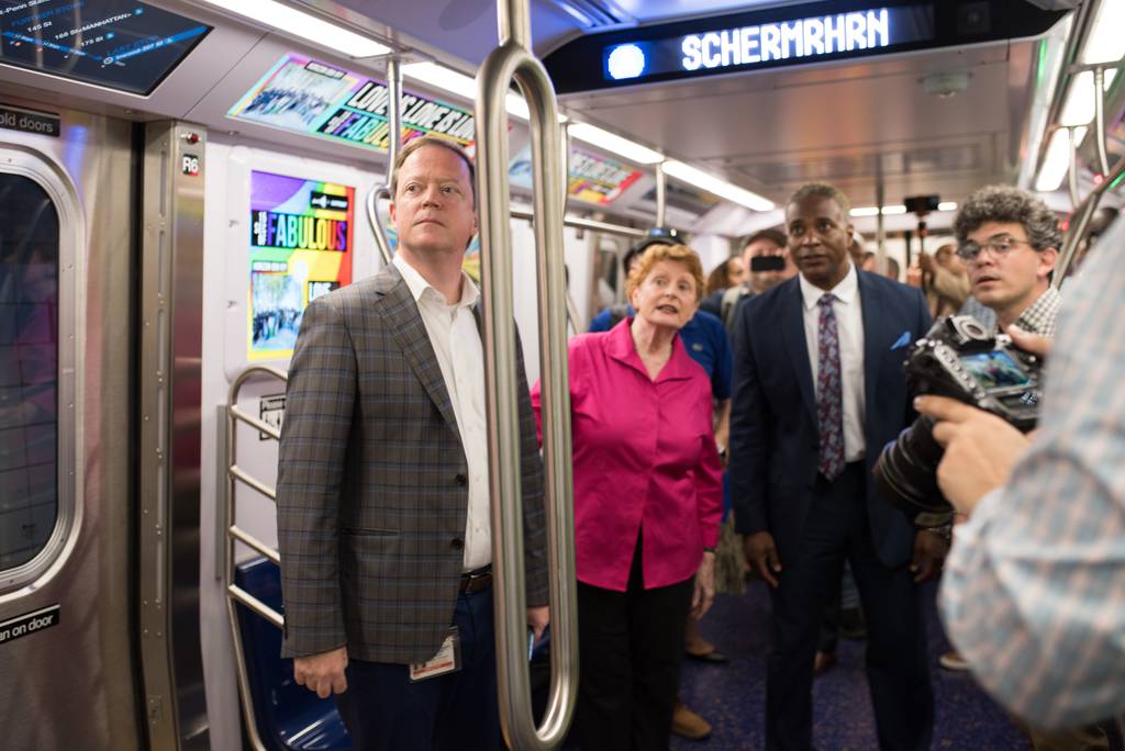 NYCT head Rich Davey tours the train along with State Assembly member Jo Anne Simon (D, Brooklyn), MTA VP of Subways Demetrius Crichlow, and City Council member Lincoln Restler (D, Brooklyn)