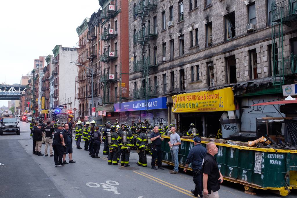 Firefighters on Friday responded after more e-bike batteries caught fire at the site of a blaze Tuesday that killed four people at 80 Madison St. in Manhattan's Chinatown