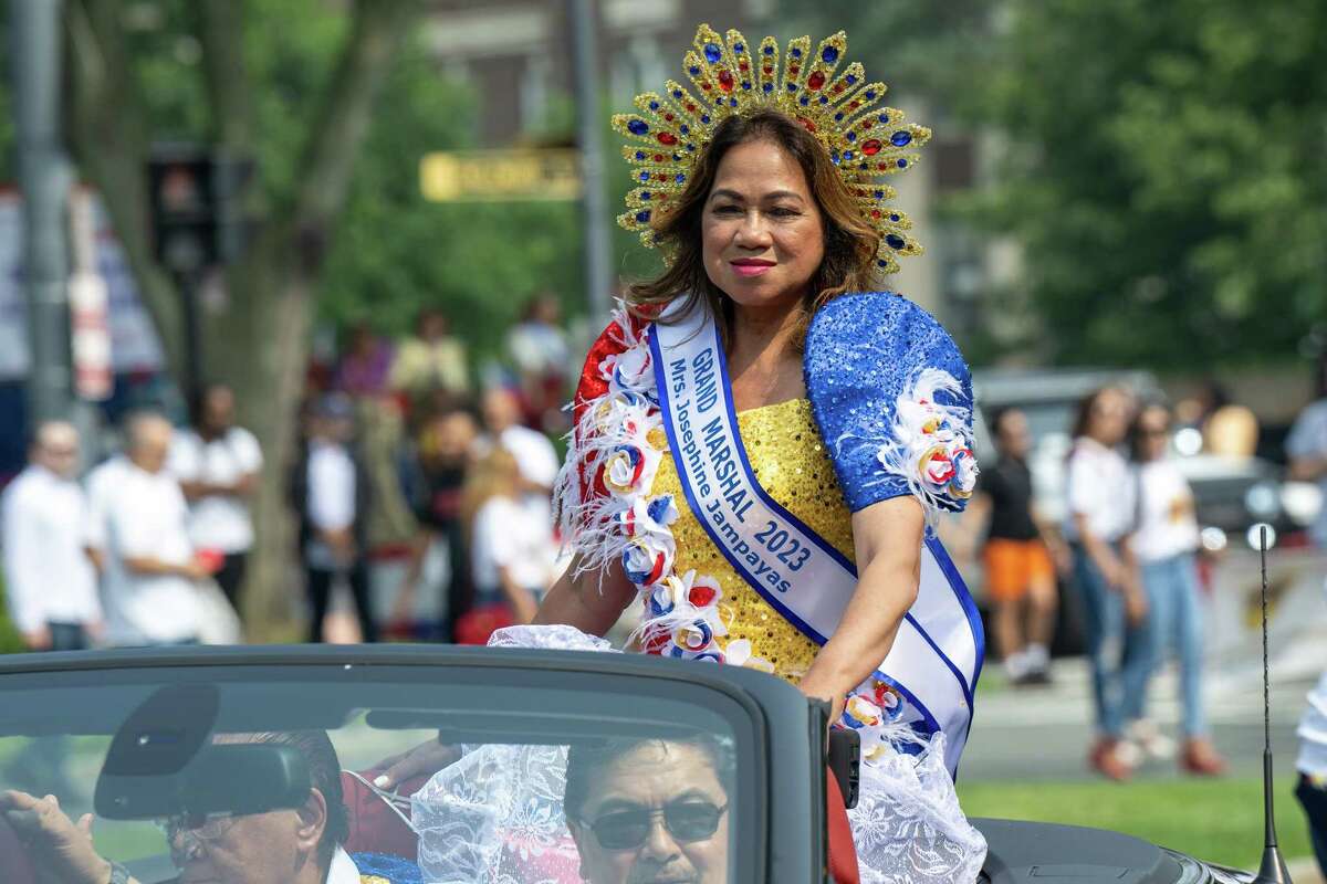 Filipino Day parade Grand Marshal Josephine Jampayas rides through Washington Park on Saturday, July 1, 2023, in Albany, NY.