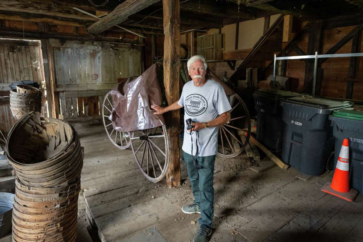 Clifton Park Town Historian John Scherer stands next to an old wagon inside the former blacksmith shop adjacent to the Historic Grooms Tavern on Saturday, July 1, 2023, in Rexford, NY. (Jim Franco/Times Union)