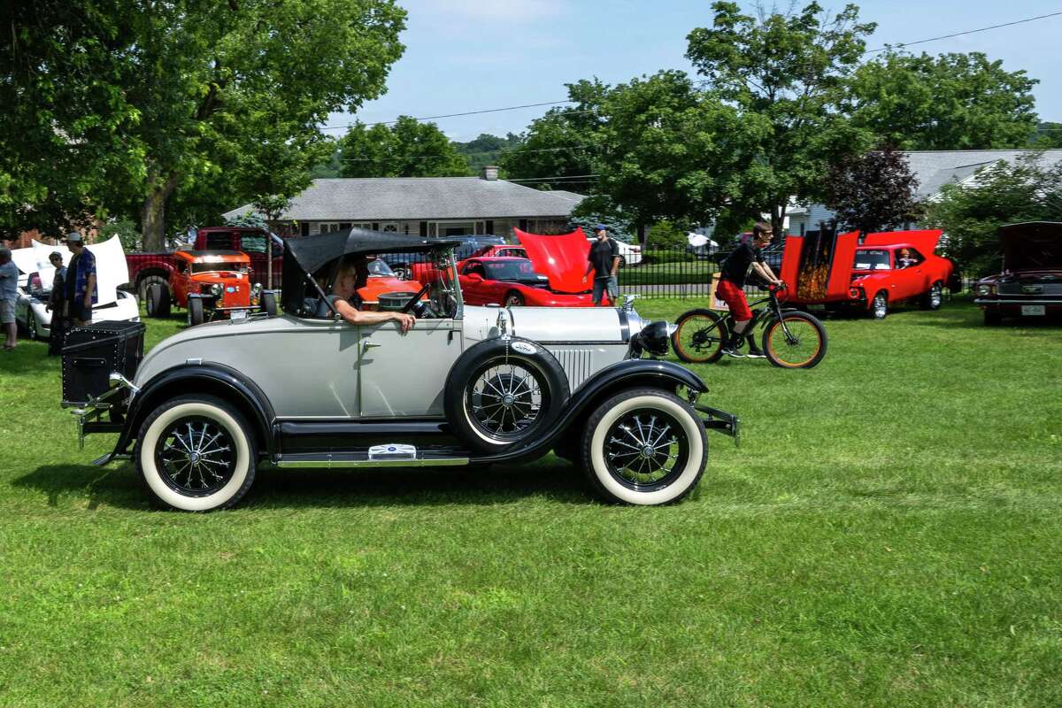 Louis Canali drives a 1928 Ford Model A into the Adirondack Muscle Car Show at the Powers Park Concert Series, which kicked off its 20th season on Saturday in Troy.