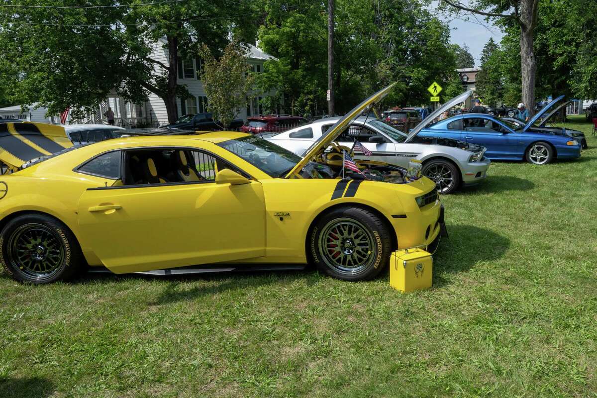 Cars on display during an Adirondack Muscle Car Show at the Powers Park Concert Series, which kicked off its 20th season on Saturday in Troy.