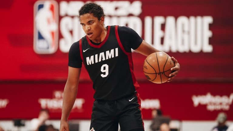 Miami Heat guard Dru Smith dribbles downcourt during an NBA...