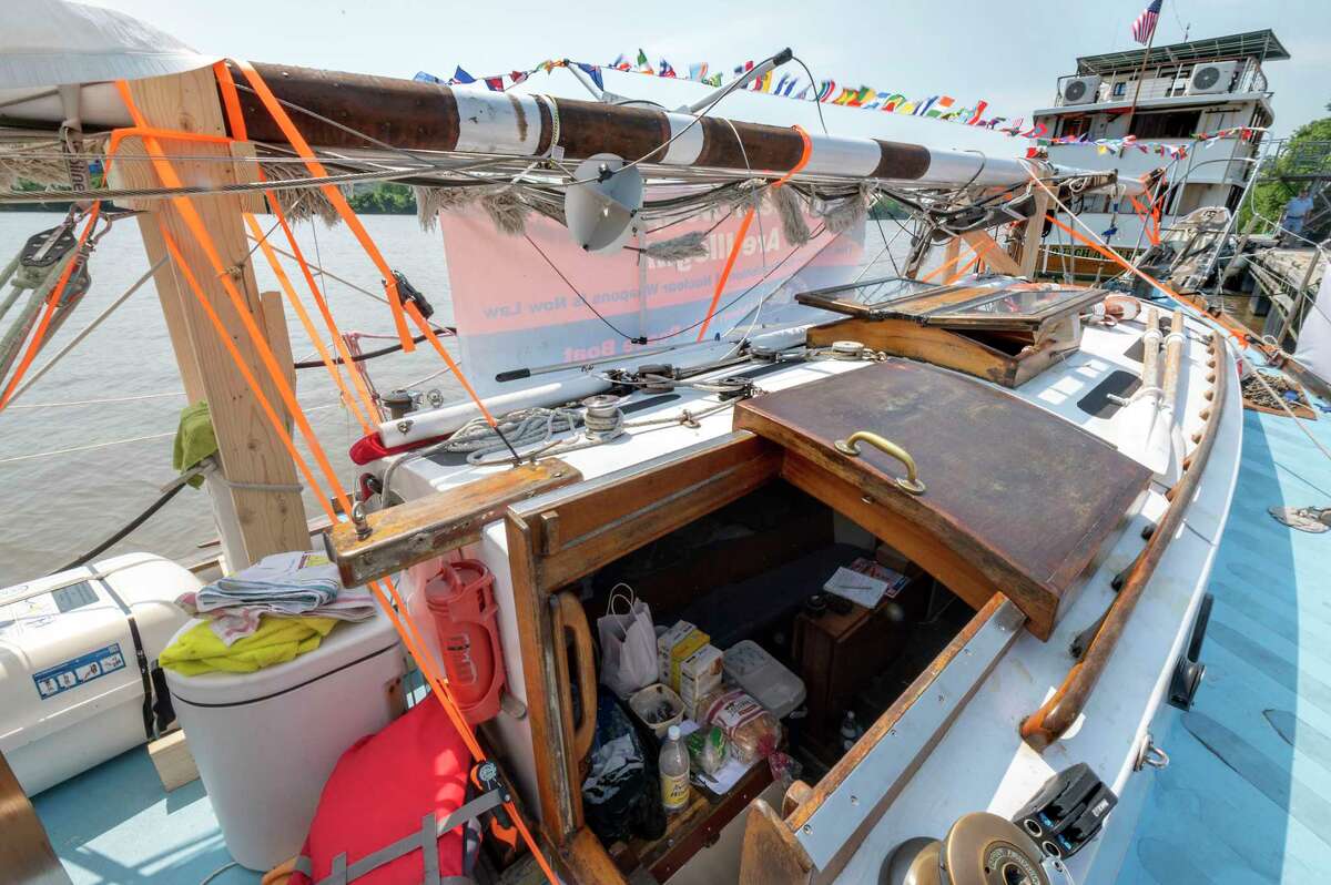 The Golden Rule Peace Boat is docked Wednesday between the USS Slater and the Dutch Apple Cruise boat in Albany. In 1958, four Quaker peace activists sailed the Golden Rule toward the Marshall Islands in an attempt to halt thermonuclear weapons testing. 