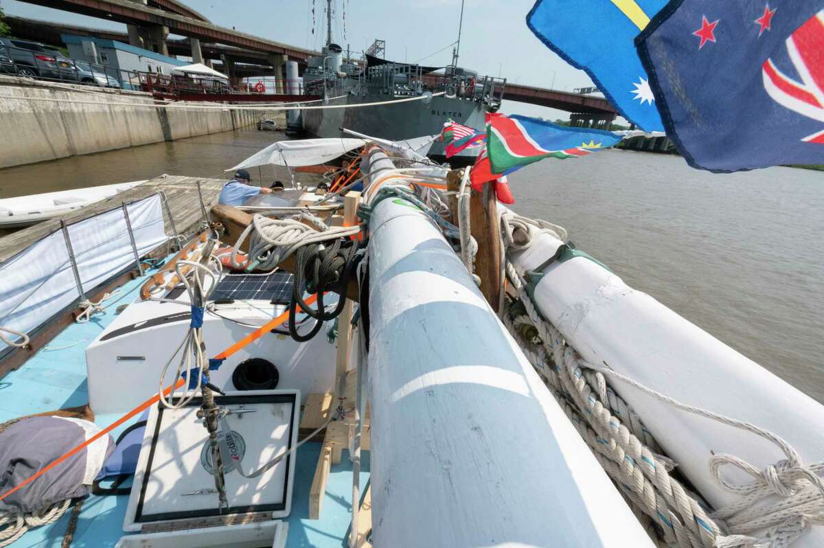 Flags from different countries fly on the lowered mast of the Golden Rule Peace Boat on Wednesday in Albany. 