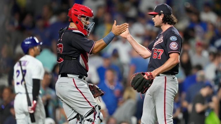 Washington Nationals relief pitcher Kyle Finnegan (67) celebrates with catcher...