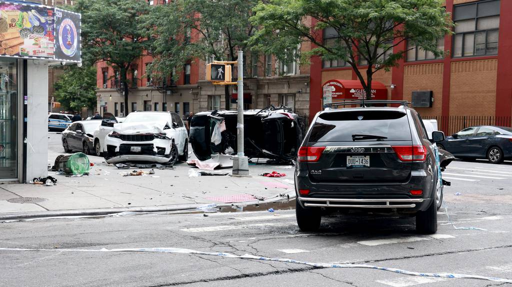 Mangled cars are seen at E. 178th St. and Audubon Ave. in upper Manhattan early Monday. 