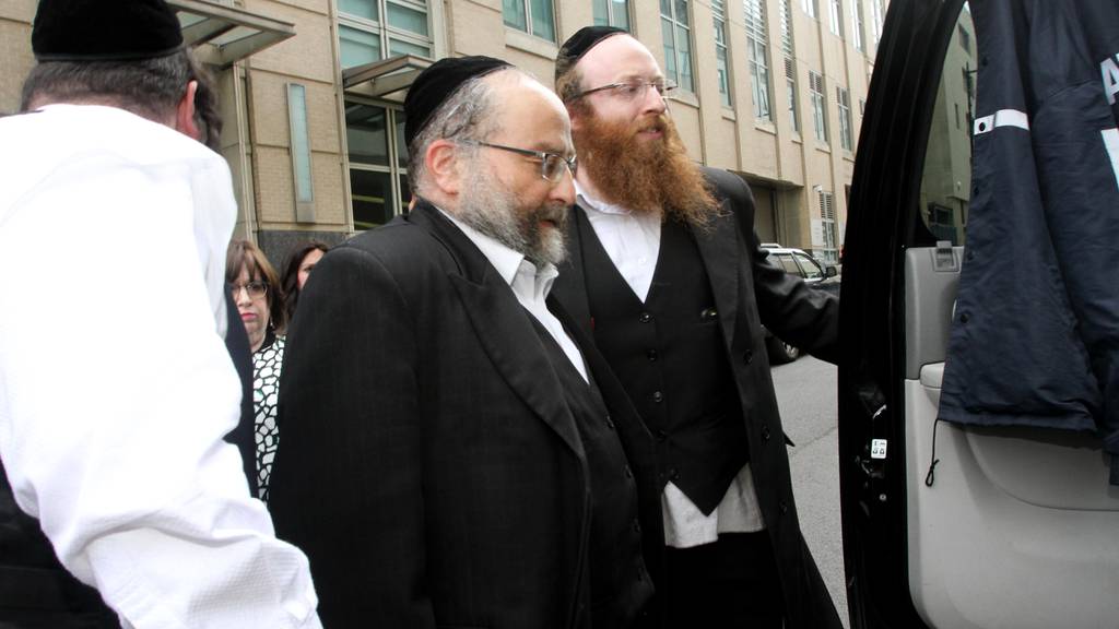 Jacob Daskal, (center) at State Supreme Court in Brooklyn where he was charged with third degree rape and other charges.  Brooklyn, New York, Friday, May11, 2018.   Jesse Ward for New York Daily News