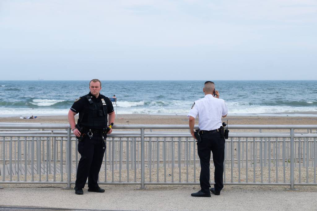 Police respond to Rockaway Beach near Beach 74th Street in Queens, New York City after a person was pulled from the water on Sunday, July 2, 2023.