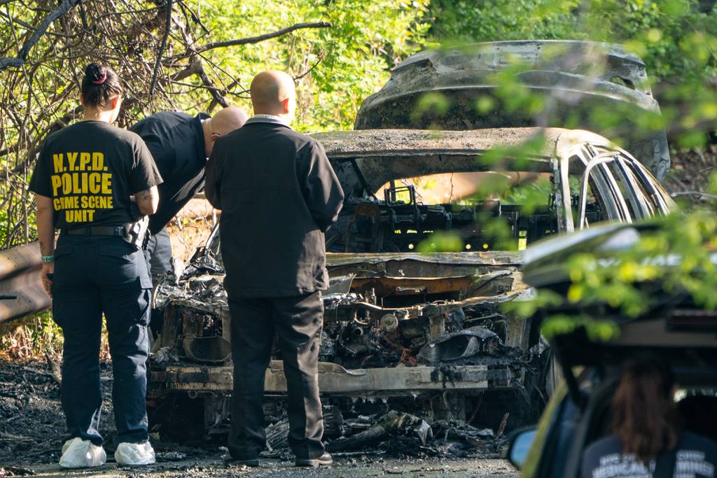 Two people were pronounced dead on scene after Firefighters extinguished a Honda Accord engulfed in flames on Shore Road in the Bronx on Monday May 16, 2022. 