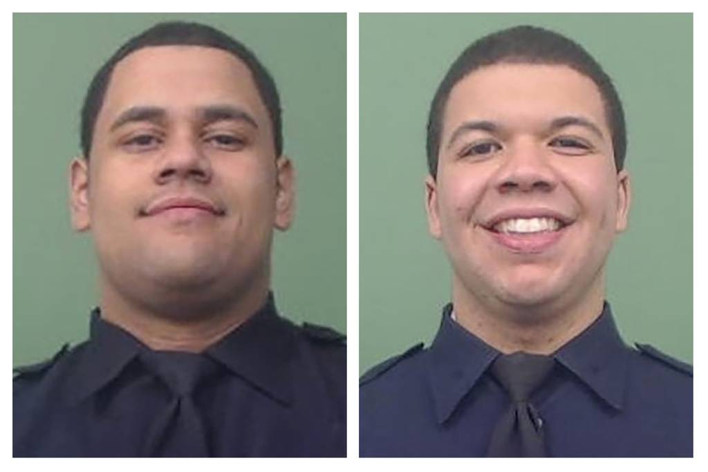 NYPD Officers Wilbert Mora (left) and Jason Rivera. The two officers were shot responding to a call about an argument between a woman and her son in Harlem on Friday, Jan. 21, 2022. 