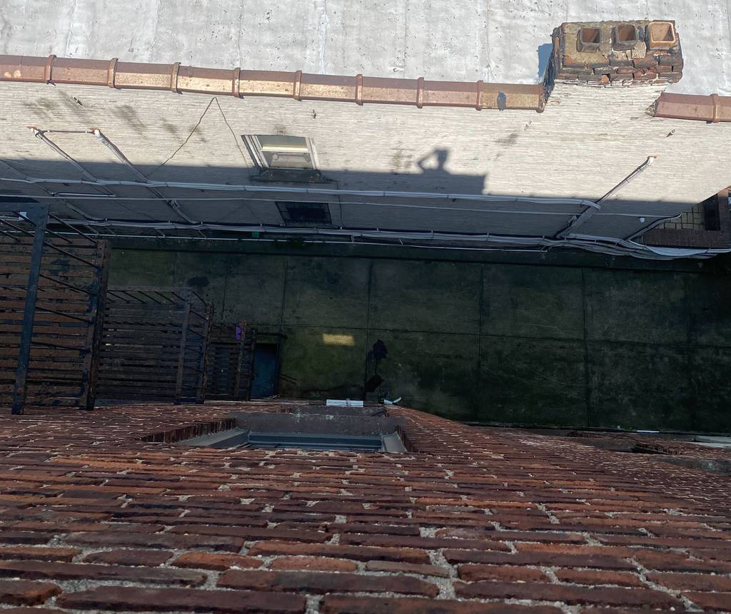 The rooftop view of the alleyway where a 4-year-old boy landed after falling from his mother’s fourth-floor apartment in Brooklyn on Monday. 