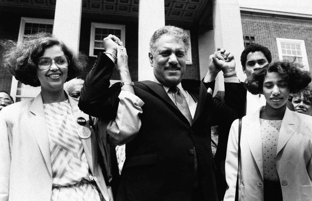 Alton R. Waldon holds hands with supporters on the steps of Queens Borough Hall in New York in 1986.