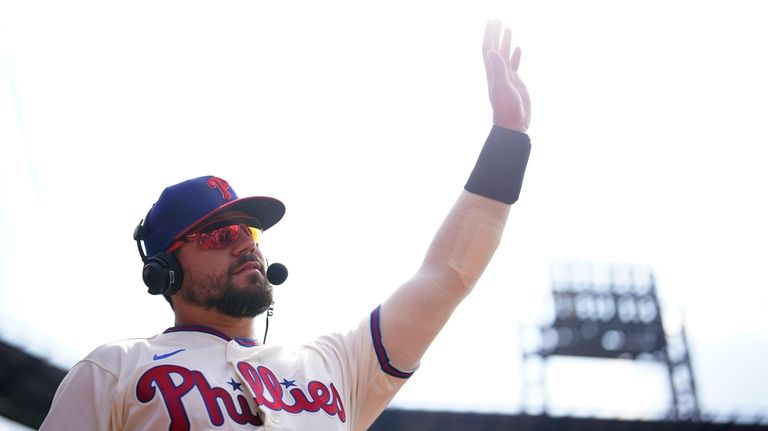 Philadelphia Phillies' Kyle Schwarber waves after the Phillies won a...