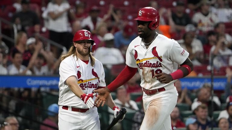 St. Louis Cardinals' Jordan Walker, right, is congratulated by teammate...