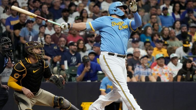 Milwaukee Brewers' Rowdy Tellez hits a three-run home run during...