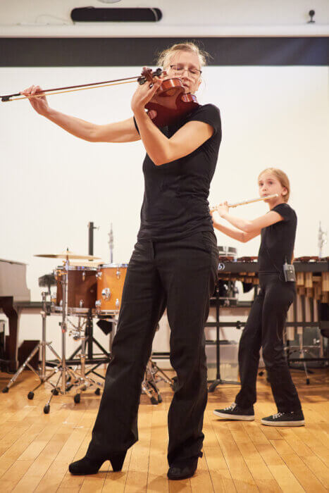 woman playing violin at little venue that could winner