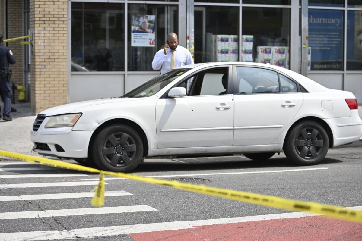 A bullet-riddled car after two people were shot in Brooklyn on Sept. 9, 2023.