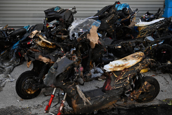 charred e-bikes at scene of fire