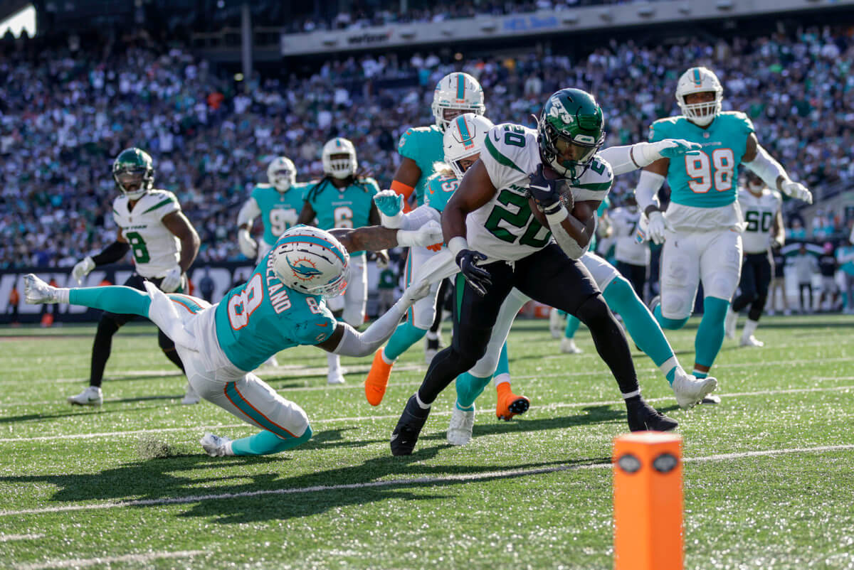 Rookie Jets running back Breece Hall carries the ball down to the 1-yard line against the Miami Dolphins.