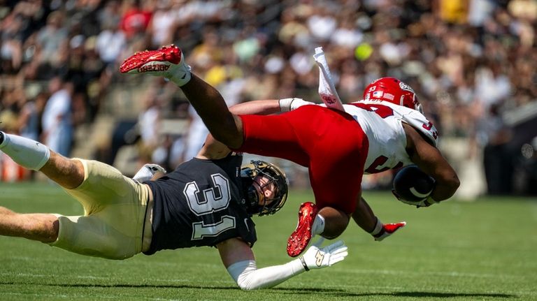 Purdue defensive back Dillon Thieneman (31) stops a run by...