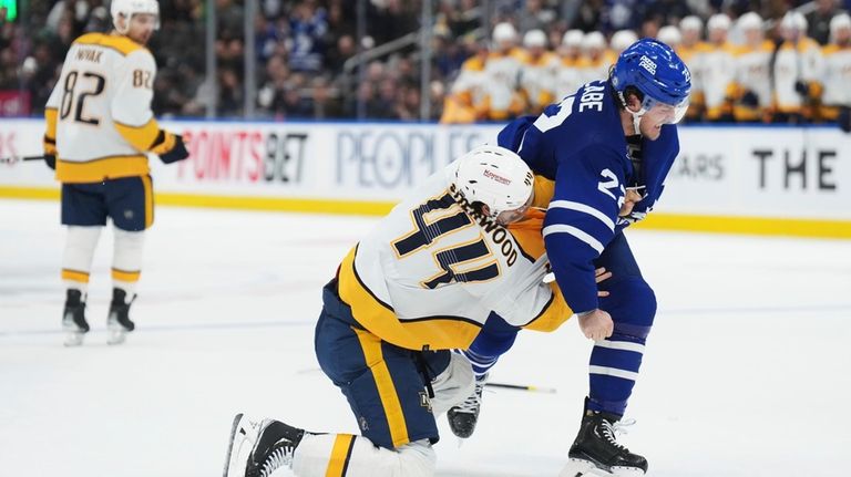 Nashville Predators forward Kiefer Sherwood (44) and Toronto Maple Leafs...