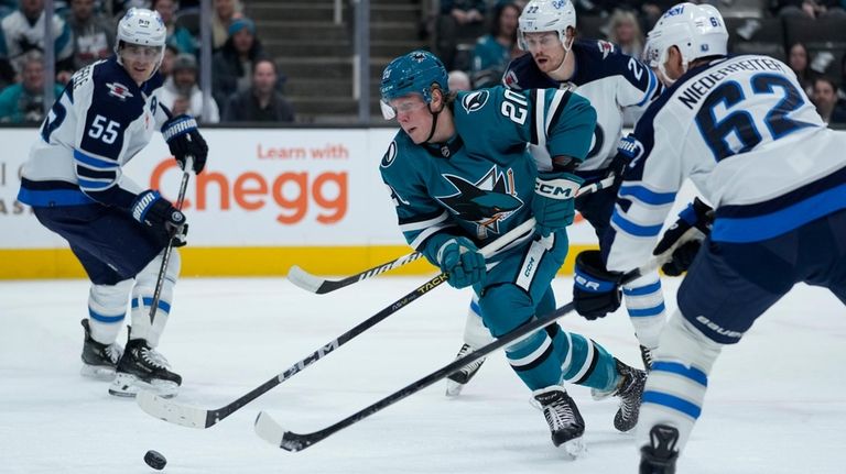 San Jose Sharks left wing Fabian Zetterlund moves the puck...