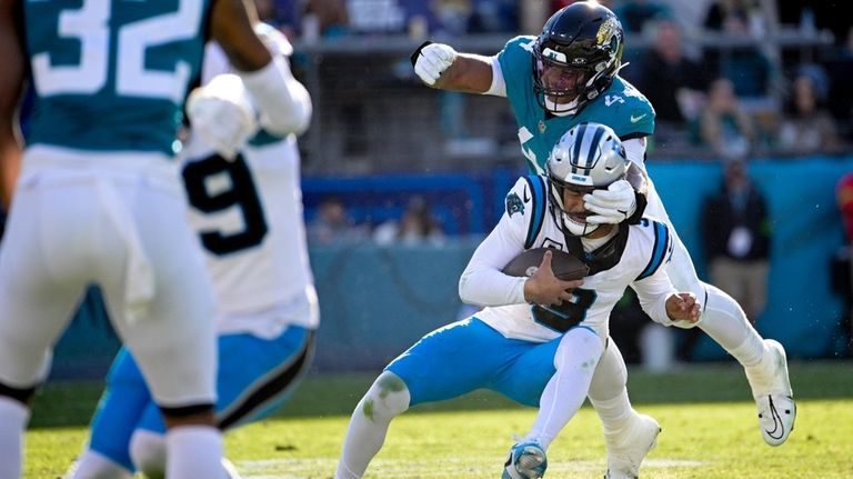 Carolina Panthers quarterback Bryce Young is sacked by Jacksonville Jaguars...