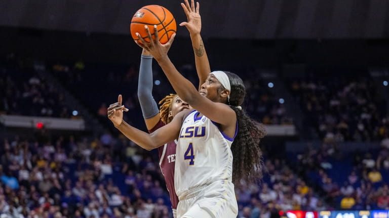 LSU guard Flau'jae Johnson (4) shoots Texas A&M forward Janiah...