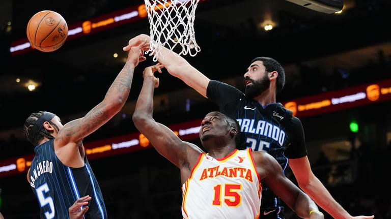 Atlanta Hawks center Clint Capela (15) battles Orlando Magic center...