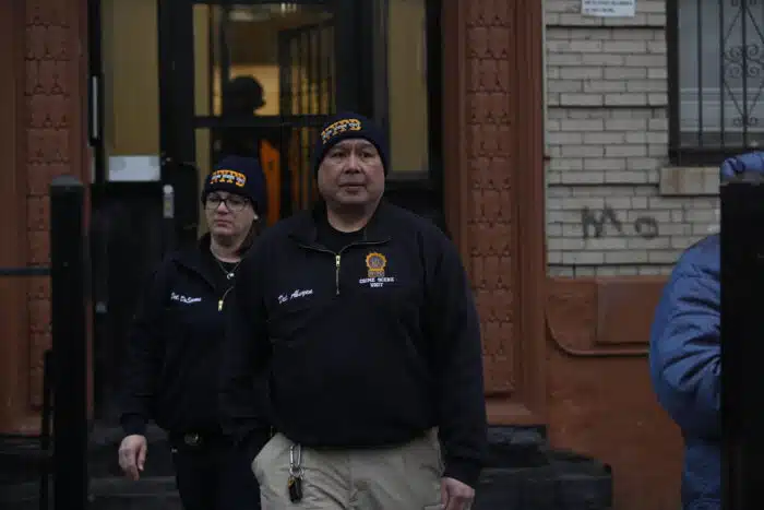 NYPD officer investigate the scene of the shooting in Brooklyn on Tuesday morning.