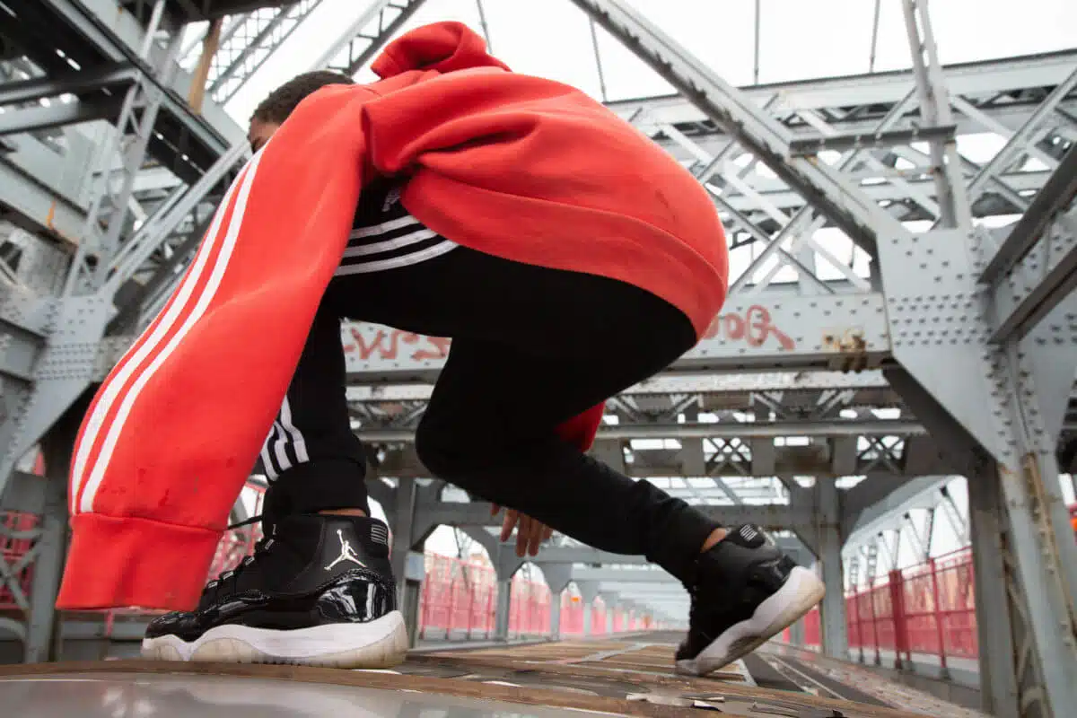 Subway surfing atop moving train on Brooklyn's Williamsburg Bridge