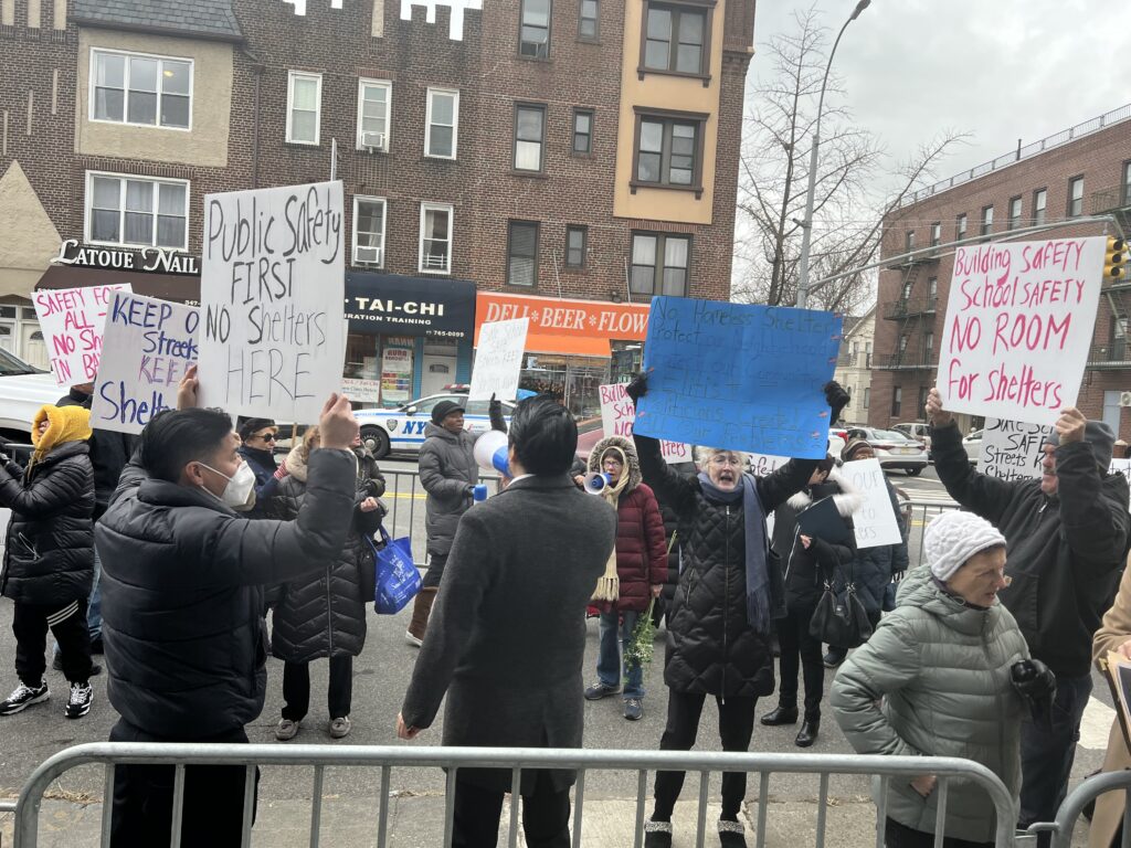 Residents protest the proposed building of a homeless shelter.