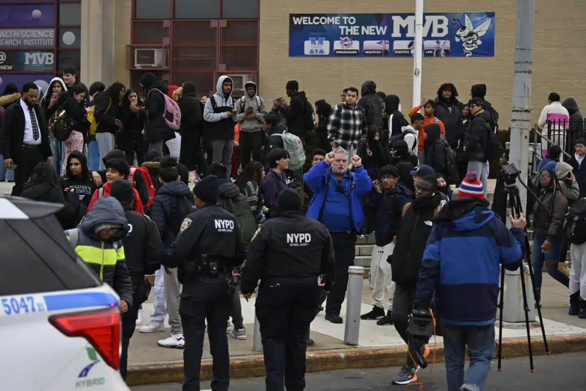 Police and Queens high school students after stabbing