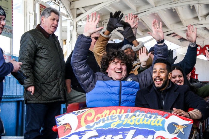 people riding on cyclone for luna park opening day 