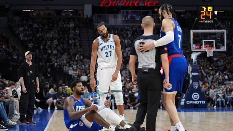 Minnesota Timberwolves center Rudy Gobert (27) reacts after being called...