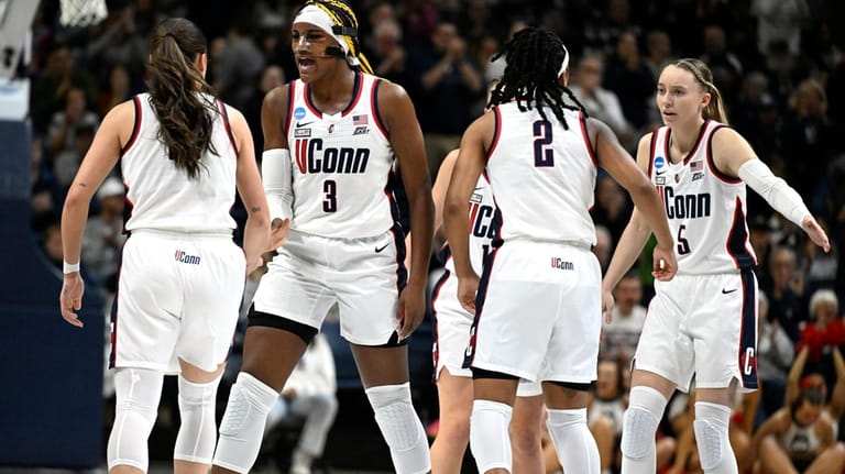 UConn guard Nika Muhl, Aaliyah Edwards, KK Arnold, and Paige...