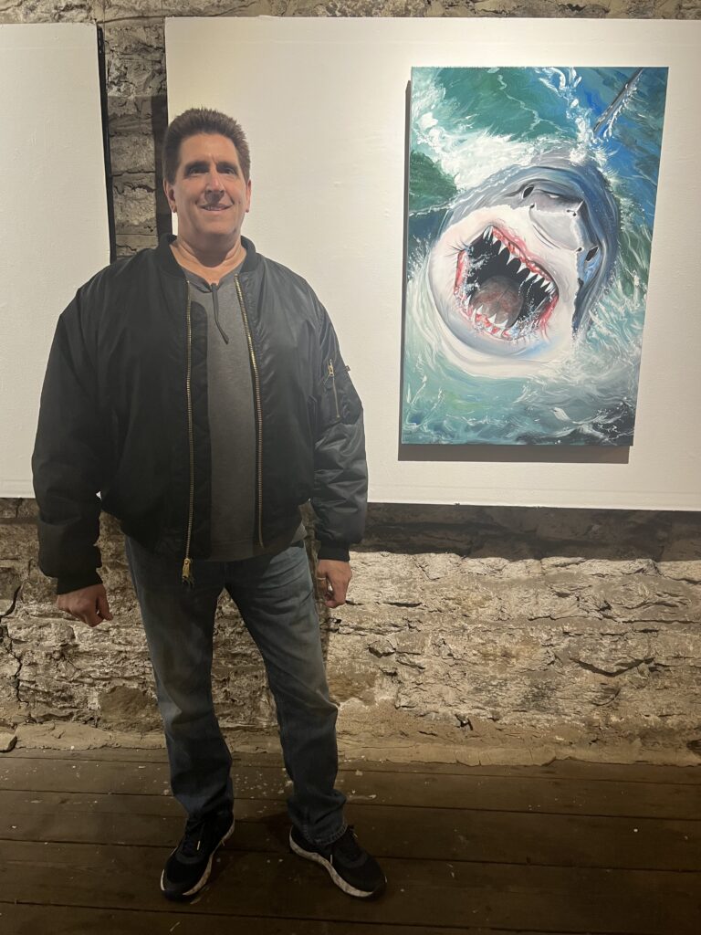 Artist Frank Recce beside his work.