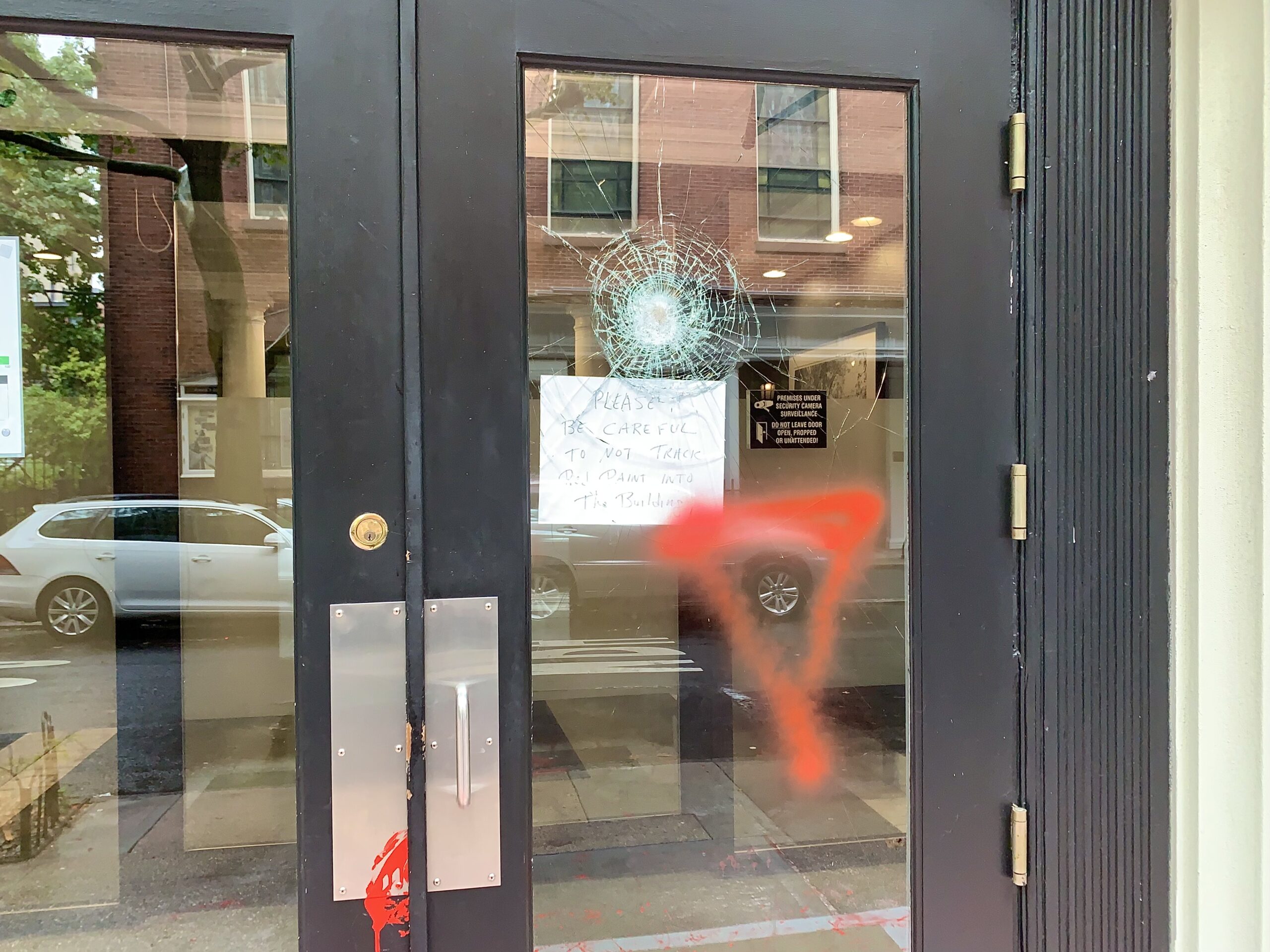 Vandals cracked the glass on the front door and reportedly threw crickets inside the vestibule. Photo by Mary Frost